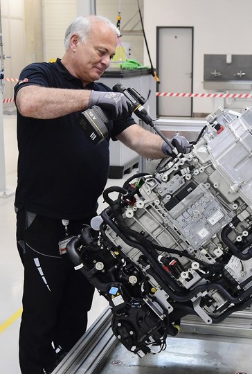 Fitter works on truck component