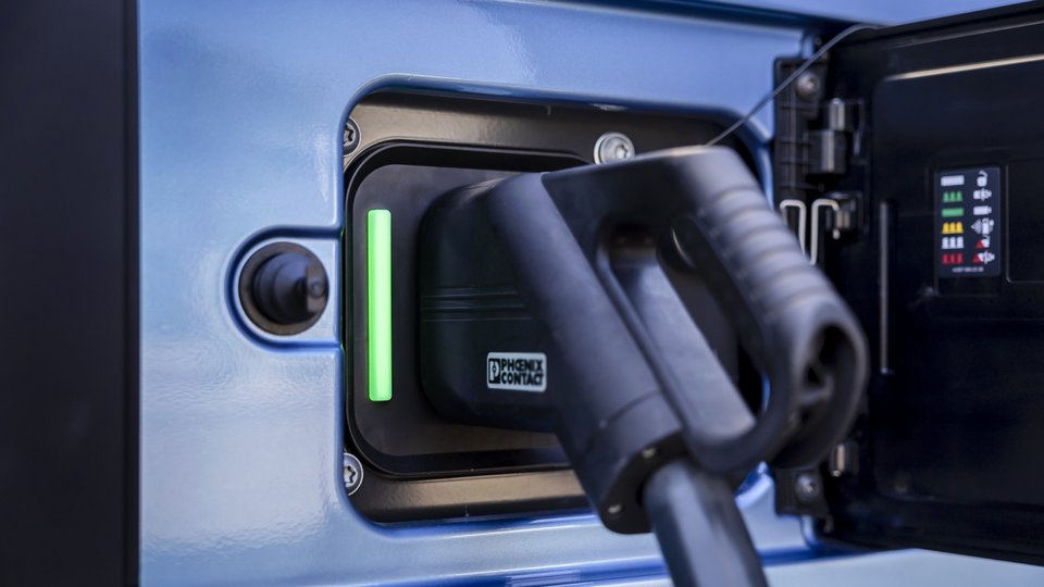 Truck is charged with an electric charging cable