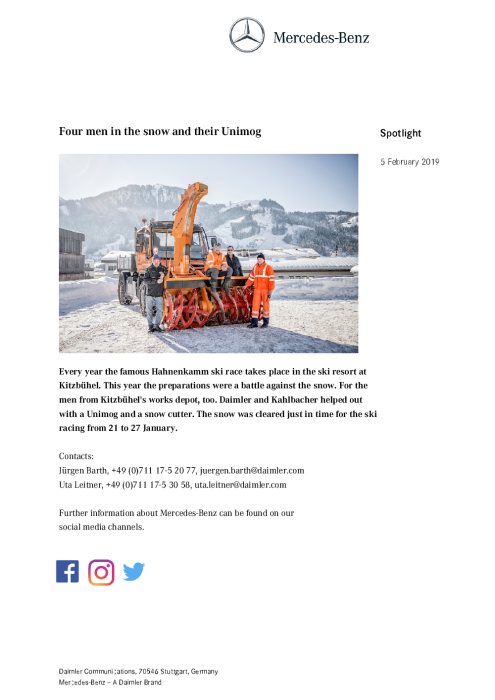 Four men in the snow and their Unimog