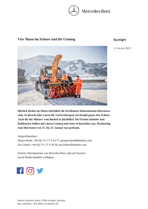 Vier Mann im Schnee und ihr Unimog